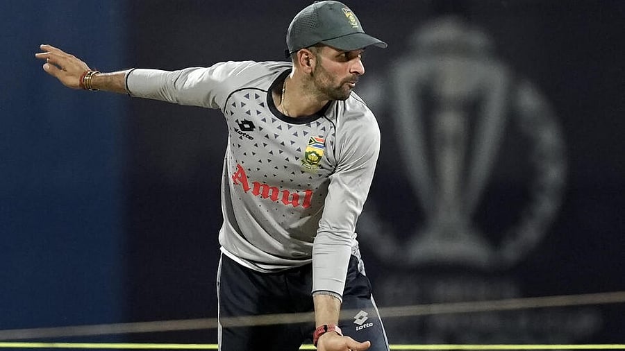 <div class="paragraphs"><p>South African player Keshav Maharaj bowls during a practice session on the eve of ICC Men's World Cup ODI cricket match between Australia and South Africa.</p></div>