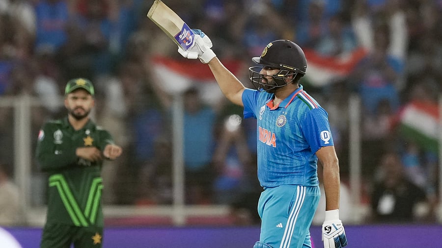 <div class="paragraphs"><p>Ahmedabad: India's Rohit Sharma celebrates after scoring a half century during the ICC Men's Cricket World Cup 2023 match between India and Pakistan, at Narendra Modi Stadium, in Ahmedabad, Saturday, Oct. 14, 2023.</p></div>