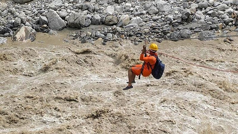 <div class="paragraphs"><p>NDRF personnel carry out rescue work in flood affected Chungthang in Mangan district of Sikkim, Tuesday, Oct. 10, 2023.</p></div>