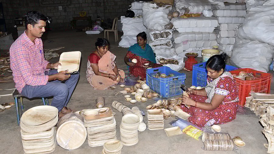 A team of workers pack areca plates at a factory in Shivamogga.