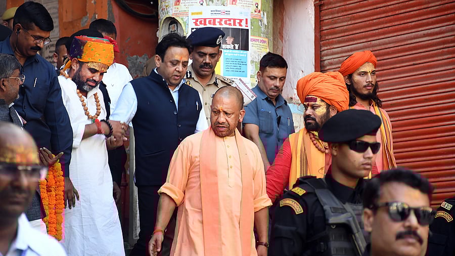 <div class="paragraphs"><p>Uttar Pradesh Chief Minister Yogi Adityanath with Hanumangarhi priest Raju Das after 'darshan' from Hanumangarhi, in Ayodhya.</p></div>