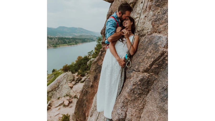 <div class="paragraphs"><p>The realities of a rock climbing wedding can lend themselves to sweet wedding photos.</p></div>
