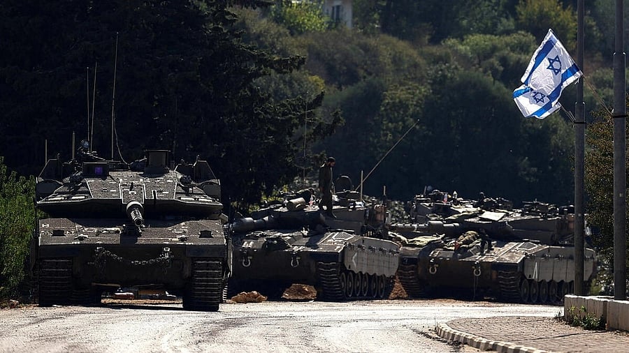 <div class="paragraphs"><p>Israeli tanks are seen on a road near Israel's border with Lebanon, in northern Israel. </p></div>