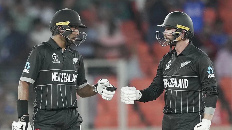 <div class="paragraphs"><p>New Zealand's batter Rachin Ravindra with teammate Devon Conway during the ICC Men's Cricket World Cup 2023 match between England and New Zealand, at the Narendra Modi Stadium in Ahmedabad, </p></div>
