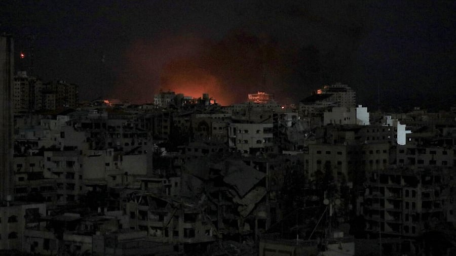 <div class="paragraphs"><p>Flames rise during an Israeli air strike on west Gaza.</p></div>