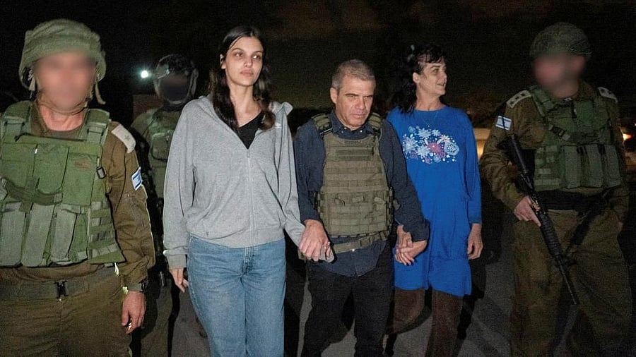 <div class="paragraphs"><p>Judith Tai Raanan and her daughter Natalie Shoshana Raanan, US citizens who were taken as hostages by Palestinian Hamas militants, walk while holding hands with Brig.-Gen. Gal Hirsch, Israel's Coordinator for the Captives and Missing, after they were released by the militants, in response to Qatari mediation efforts, in this handout picture obtained by Reuters on October 20, 2023.</p></div>