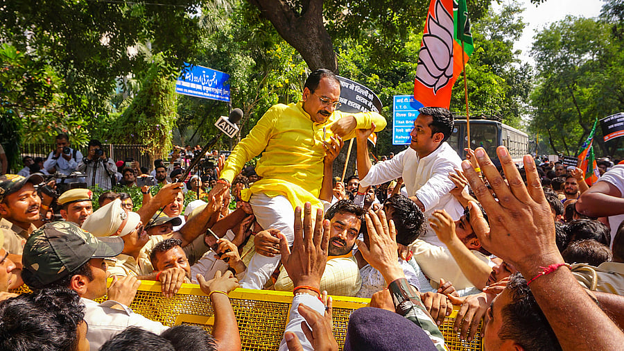 <div class="paragraphs"><p>Delhi BJP President Virendraa Sachdeva with party workers protests against Delhi government over liquor policy, outside AAP office, in New Delhi, Thursday, October 12, 2023.</p></div>
