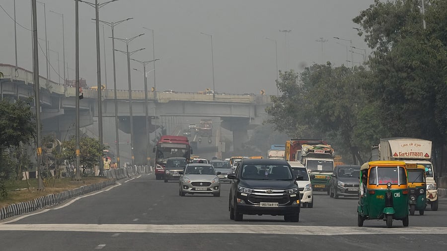 <div class="paragraphs"><p>Commuters on a road amid smog, in New Delhi. </p></div>