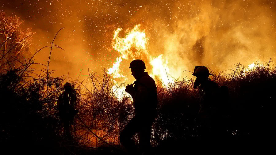 <div class="paragraphs"><p>Firefighters work to put out a fire in an open field, following a mass-infiltration by Hamas gunmen from the Gaza Strip, near a hospital in Ashkelon, southern Israel October 7, 2023. </p></div>