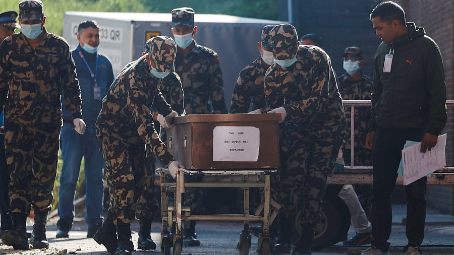 <div class="paragraphs"><p>Nepal army personnel move a coffin carrying the body of a Nepali student who was killed in an attack by the Palestinian militant group Hamas on Israel, upon its arrival in Kathmandu.</p></div>