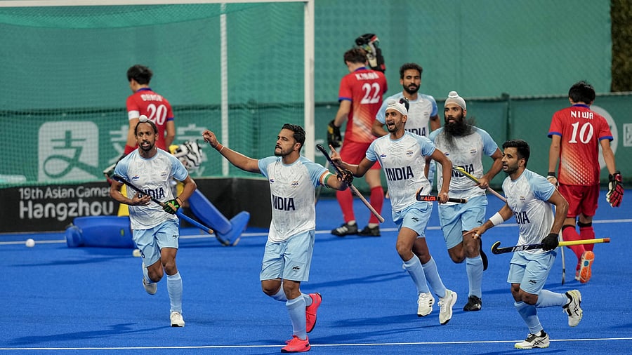<div class="paragraphs"><p>India's captain Harmanpreet Singh celebrates with teammates after scoring a goal against Japan during the Men's Hockey Final match at the 19th Asian Games </p></div>