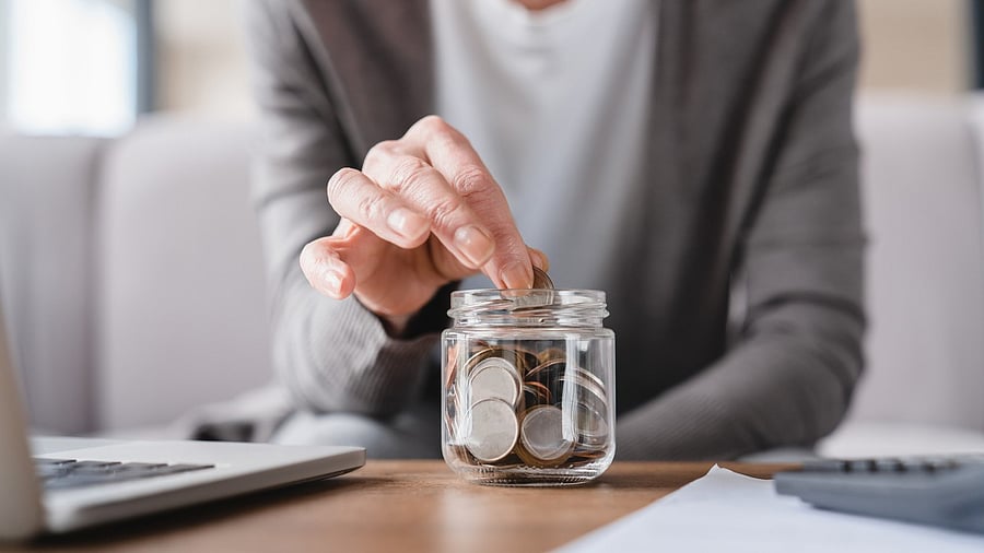 <div class="paragraphs"><p>Representative image showing a senior citizen depositing coins in a jar.</p></div>