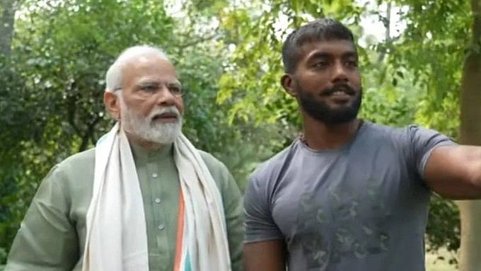 <div class="paragraphs"><p>Narendra Modi and&nbsp;Ankit Baiyanpuriya.</p></div>