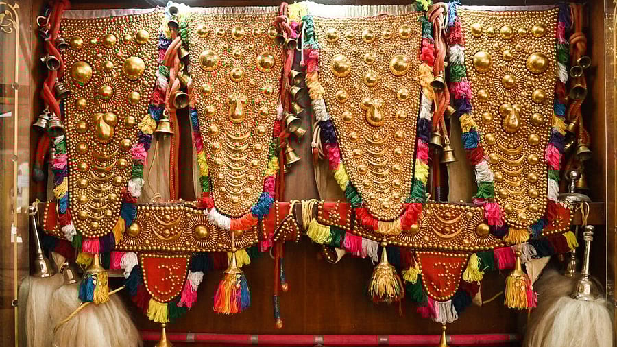 <div class="paragraphs"><p>Gold-plated ornaments used to decorate Dasara elephants are on display at one of the gates to the Mysuru palace. </p></div>