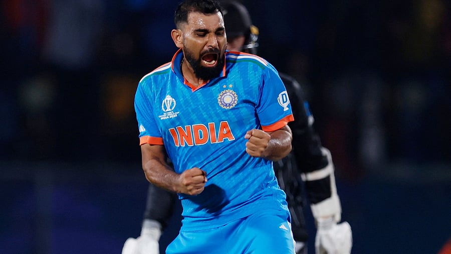 <div class="paragraphs"><p> Mohammed Shami celebrates after taking the wicket of New Zealand's Matt Henry.&nbsp;</p></div>