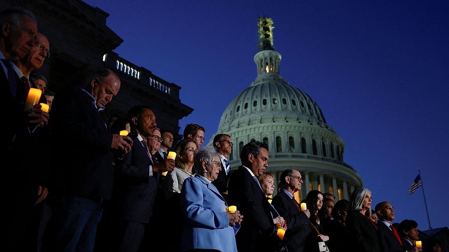 <div class="paragraphs"><p>Members of the House of Representatives hold a candlelight vigil for Israel outside the US Capitol building in Washington.</p></div>