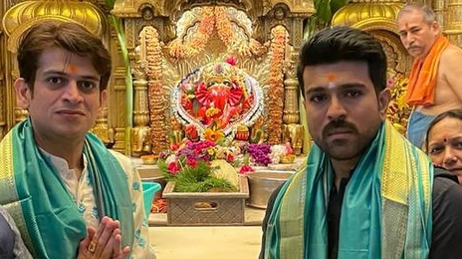<div class="paragraphs"><p>Ram Charan with politician Rahul Kanal at Siddhivinayak Temple.</p></div>