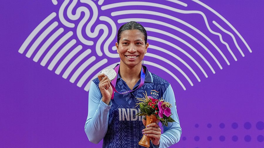 <div class="paragraphs"><p>Silver medallist India's Lovlina Borgohain poses for photos during the presentation ceremony of women's 66-75kg category boxing event at the 19th Asian Games, in Hangzhou, China.</p><p> </p></div>