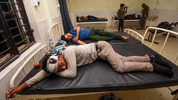 <div class="paragraphs"><p>Injured passengers being treated at a nearby government hospital a day after six coaches of the Delhi-Kamakhya North East Express derailed near Raghunathpur station in Buxar district.</p></div>