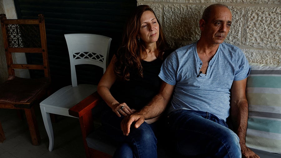 <div class="paragraphs"><p>Nissim and Ricarda Louk, the parents of Shani Louk, 22, who was taken hostage by Hamas after being seized from the Nova festival, following a deadly infiltration by Hamas gunmen from the Gaza Strip into Israel, and who was later confirmed dead by Israel's government, are photographed in their home in Srigim-Li On, Israel October 31, 2023. </p></div>