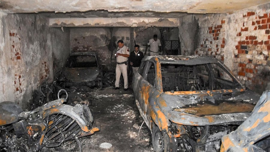 <div class="paragraphs"><p>Police inspect after a fire broke out in Shakarpur, in east Delhi.</p></div>