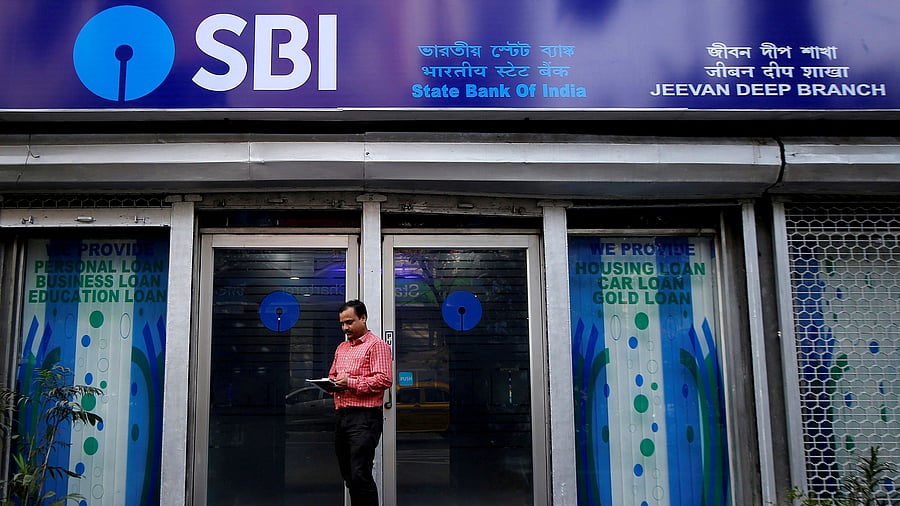 <div class="paragraphs"><p>Representative image showing a man standing in front of an SBI branch.</p></div>