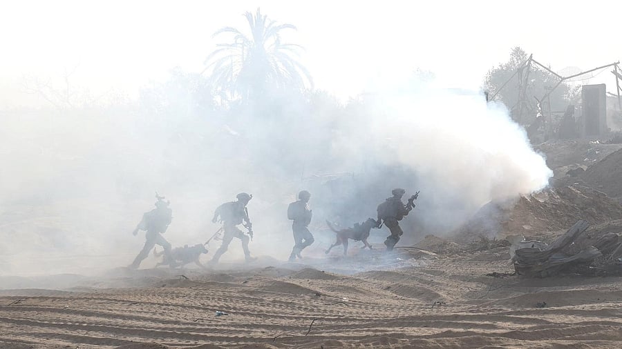 <div class="paragraphs"><p>Israeli soldiers take a position inside the Gaza Strip, amid the ongoing ground operation of the Israeli army against Palestinian Islamist group Hamas, according to the Israeli Defense Forces (IDF), in this handout picture obtained by Reuters on November 11, 2023. </p></div>