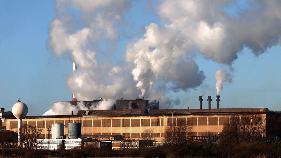 FILE PHOTO: Smoke rises from chimneys at a factory in the port of Dunkirk, France  January 19, 2023. REUTERS/Yves Herman/File Photo