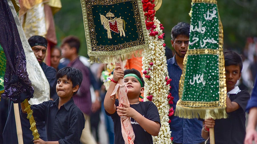 <div class="paragraphs"><p>Children carry alams and take part in the Muharram procession in Karnataka. </p></div>