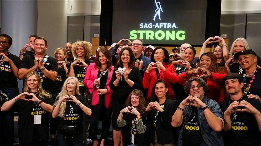 <div class="paragraphs"><p>SAG-AFTRA union President Fran Drescher and SAG-AFTRA chief negotiator Duncan Crabtree-Ireland pose for a group photo after the SAG-AFTRA TV/Theatrical Committee approved a tentative agreement with the Alliance of Motion Picture and Television Producers  to bring an end to the actors strike, in Los Angeles, California, US, November 10, 2023. </p></div>