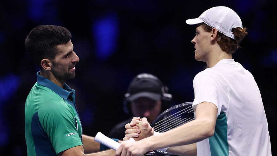 <div class="paragraphs"><p> Italy's Jannik Sinner shakes hands with Serbia's Novak Djokovic after winning their group stage match</p></div>
