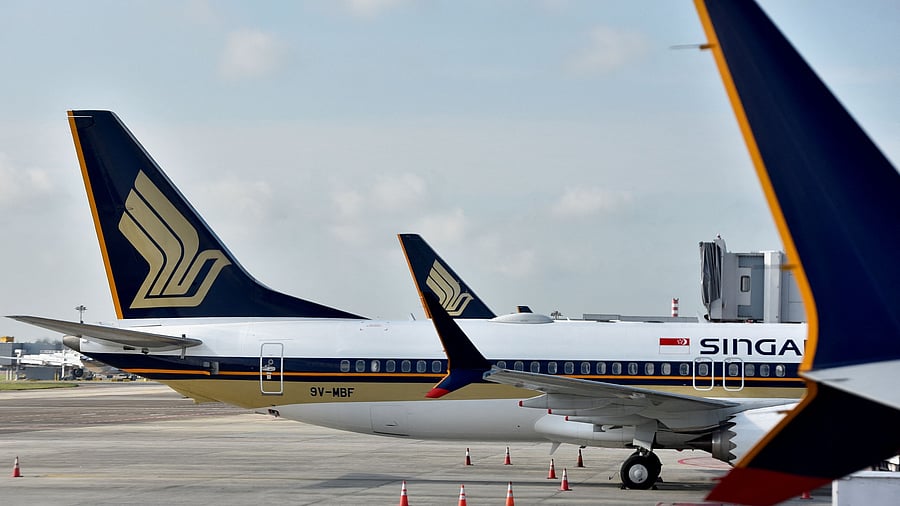 <div class="paragraphs"><p>Singapore Airlines planes sit on the tarmac at Changi Airport in Singapore. </p></div>