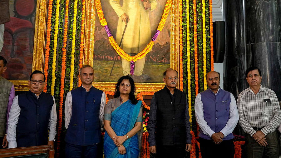 <div class="paragraphs"><p>Lok Sabha Secretary General Utpal Kumar Singh and other officials pay tribute to the first education minister of India Abul Kalam Azad on his birth anniversary, at the Samvidhan Sadan’s Central Hall, in New Delhi, Saturday, Nov. 11, 2023.</p></div>