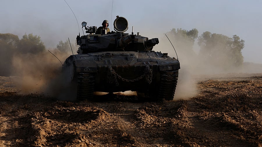 <div class="paragraphs"><p>An Israeli tank maneuvers, amid the ongoing conflict between Israel and the Palestinian group Hamas, near Israel's border with Gaza in southern Israel.</p></div>
