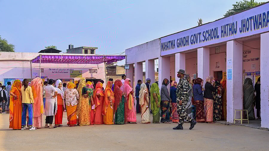 <div class="paragraphs"><p>People stand in queue at a polling booth to cast vote during Rajasthan Assembly elections, in Jaipur, Saturday, Nov. 25, 2023.</p></div>