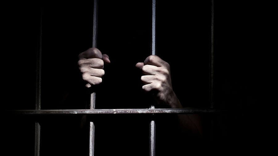 <div class="paragraphs"><p>Representative image of a man in a jail cell.</p></div>