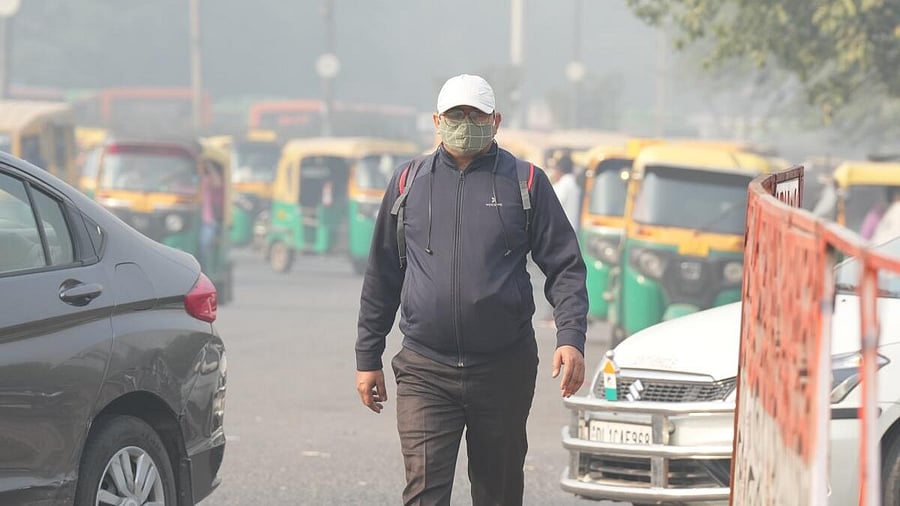 <div class="paragraphs"><p>A man wears a mask to protect himself from growing level of air pollution, in New Delhi. </p></div>