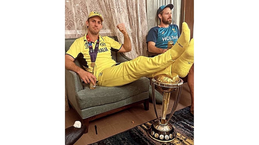 <div class="paragraphs"><p>Marsh was seen sitting on a sofa resting his feet on the World Cup trophy. </p></div>