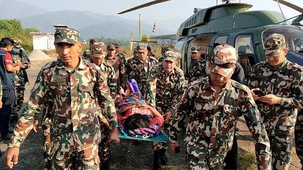<div class="paragraphs"><p>Army personnel carry an injured person on a stretcher after an earthquake in Jajarkot, Nepal, November 4, 2023.</p></div>