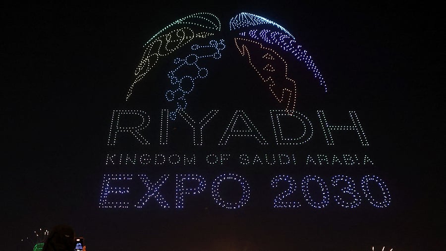 <div class="paragraphs"><p>People watch fireworks and a light show, as Saudi Arabia celebrates winning its bid to host the World Expo 2030, in Riyadh.</p></div>