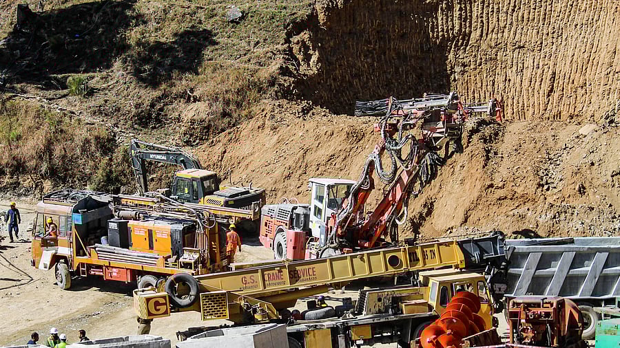 <div class="paragraphs"><p>NDRF personnel and others at the under-construction tunnel between Silkyara and Dandalgaon on the Brahmakhal-Yamunotri national highway, days after a portion of the tunnel collapsed trapping several workers inside, in Uttarkashi district. </p></div>
