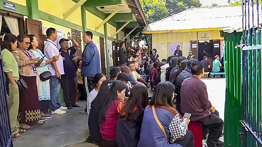 <div class="paragraphs"><p>Voters wait at a polling station to cast their votes for Mizoram Assembly elections, in Aizawl. </p></div>