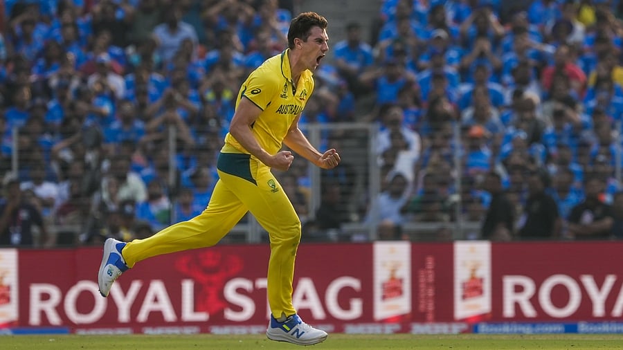 <div class="paragraphs"><p>Australia's Pat Cummins celebrates after taking the wicket of India's Virat Kohli during their World Cup final at the Narendra Modi Stadium in Ahmedabad on Sunday. </p></div>