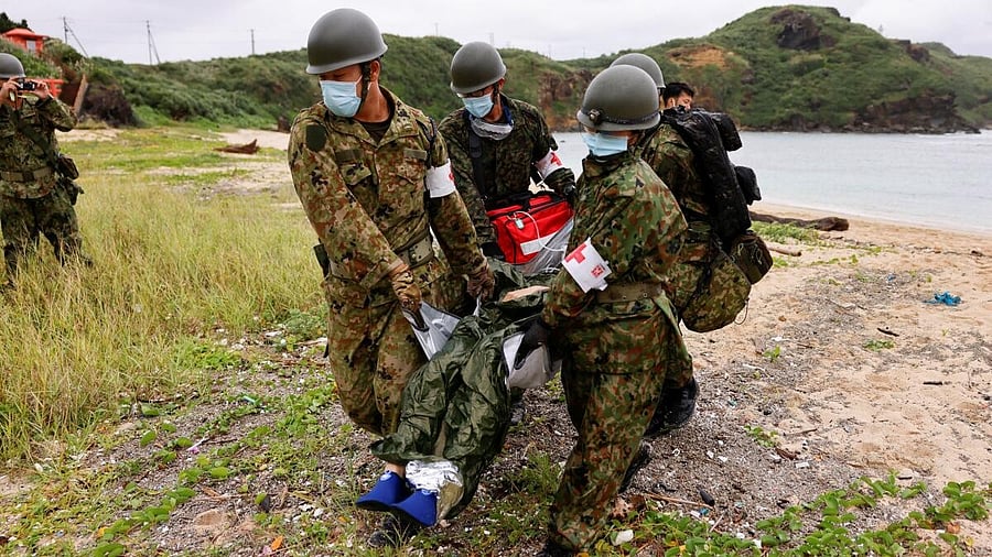 <div class="paragraphs"><p>Japan Self-Defense Forces soldiers take part in an evacuation drill on Yonaguni island, Japan's westernmost inhabited island in Okinawa prefecture, Japan November 12, 2023.</p></div>