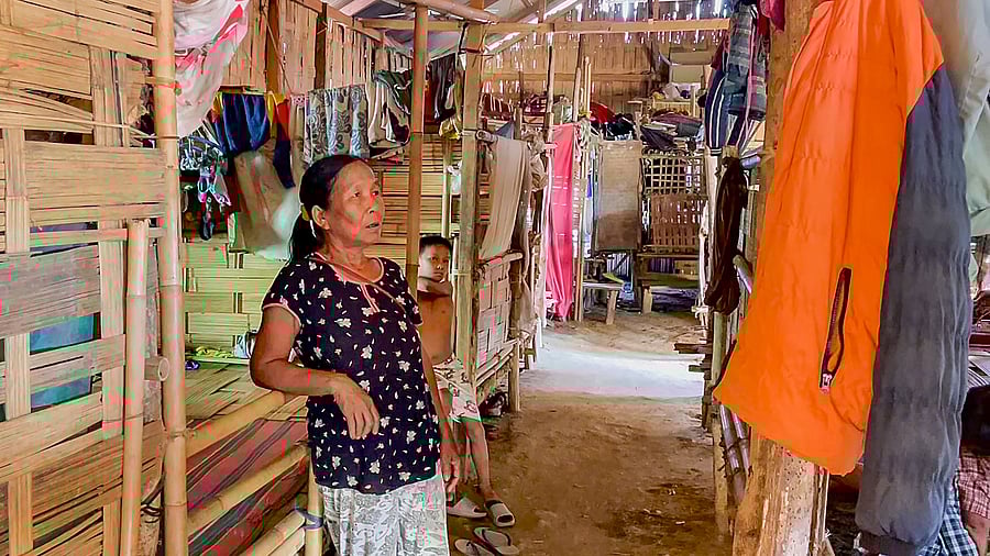 <div class="paragraphs"><p>A woman from Myanmar with her son at a relief camp at Sihhmui village, in Aizawl district, Mizoram. </p></div>