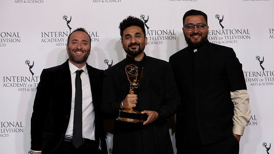 <div class="paragraphs"><p>Writer, Director and Executive Producer Vir Das and Executive Producer Reg Tigerman pose with the Best Comedy award for 'Vir Das: Landing' at the 51st International Emmy Awards in New York City.</p></div>