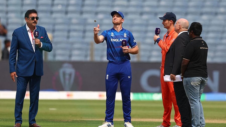 <div class="paragraphs"><p>England's Jos Buttler in action with Netherlands' Scott Edwards during the coin toss. </p></div>