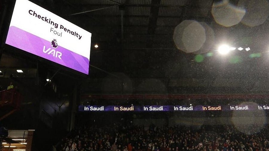 <div class="paragraphs"><p>The big screen displays a VAR review message leading to a penalty to Sheffield United.</p></div>