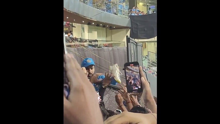 <div class="paragraphs"><p>Rohit Sharma seen giving his shoes to a fan in a video.</p></div>