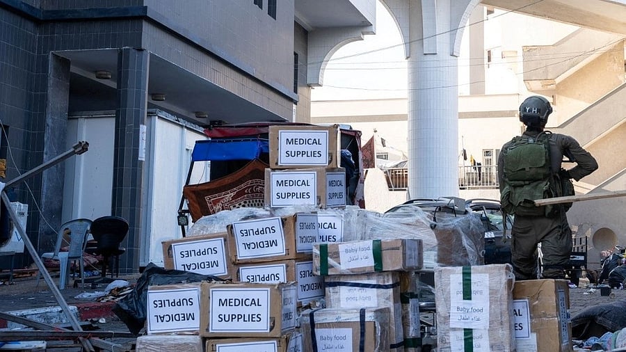 <div class="paragraphs"><p>Israeli soldier stands near boxes labelled "Medical Supplies" at the Al Shifa hospital complex, amid their ground operation against Palestinian Islamist group Hamas, during what they say is a delivery of humanitarian aid to the facility in Gaza City, November 15, 2023 in this handout image.    </p></div>